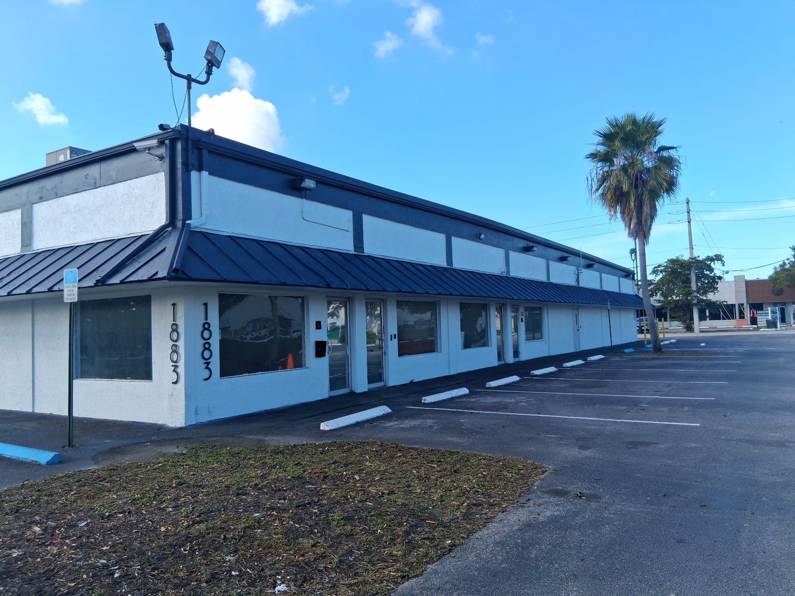 Side view of the 1883 building exterior and storefront windows
