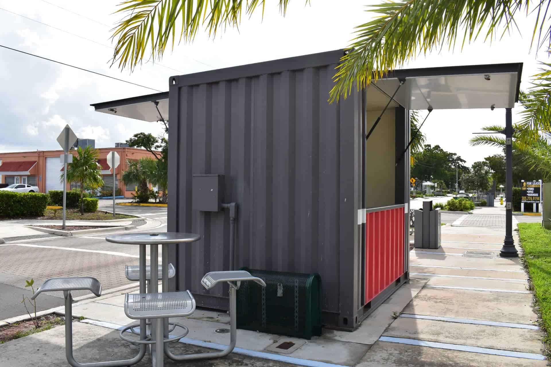 Side view of a CRA public kiosk with seating