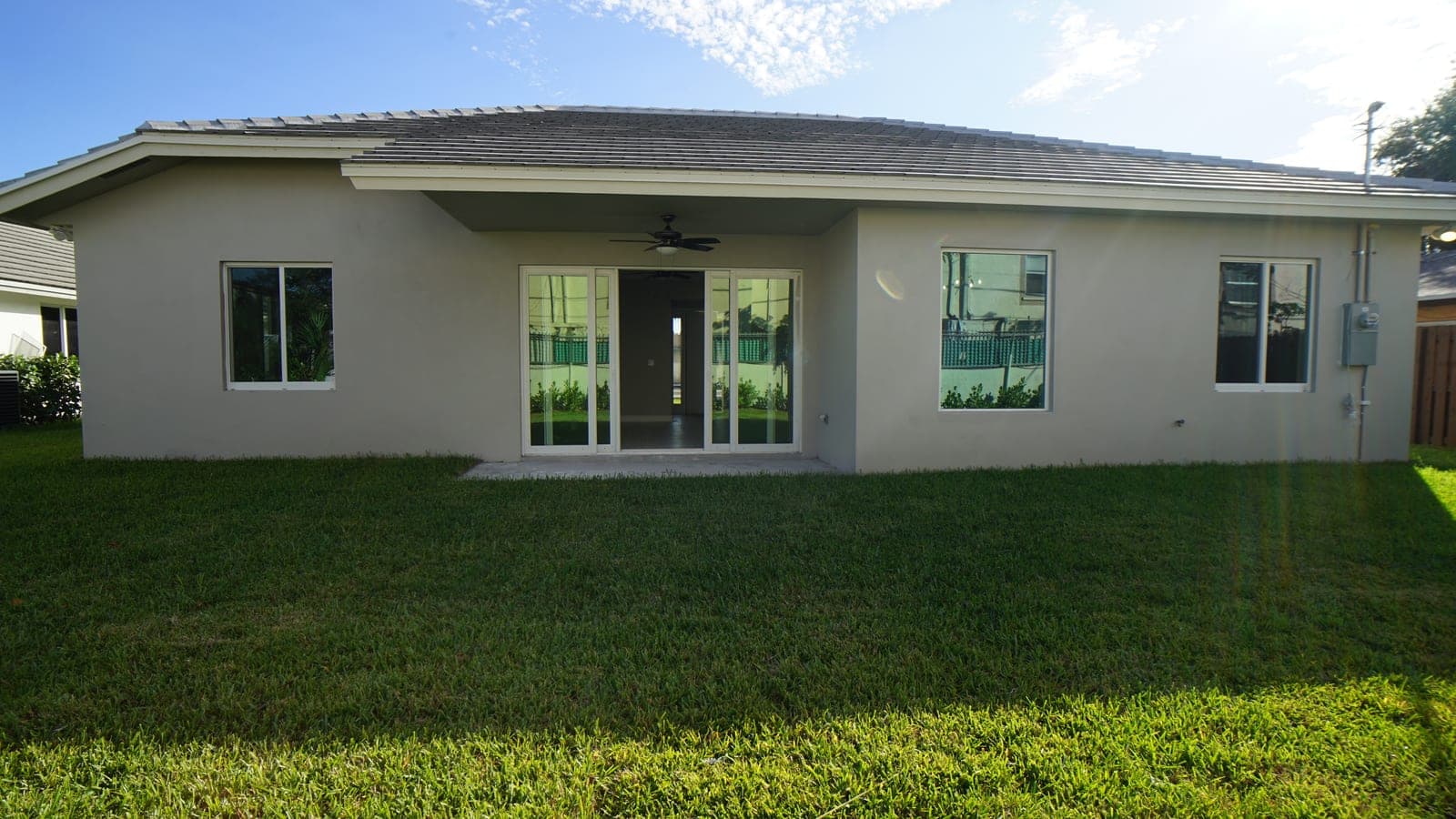 Backyard lawn and covered rear patio at Renaissance Pointe