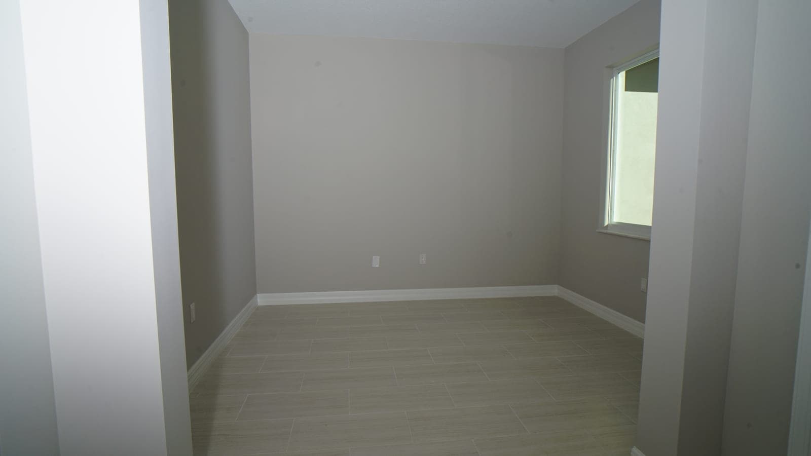 Front entrance side room with tile flooring